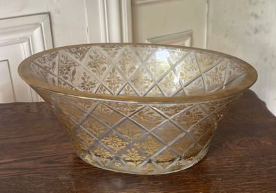 a glass bowl sitting on a table in a room