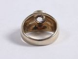 a close up of a ring with a stone in it