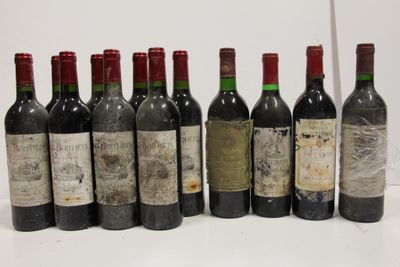 several bottles of wine are lined up in a row