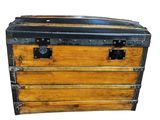 a wooden chest with metal latches on it