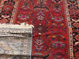 two rugs that are on the floor in the room
