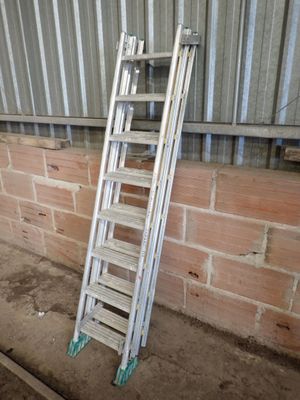 a ladder leaning against a brick wall in a building