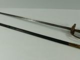 pair of two swords on display on a white surface