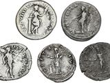 six ancient roman coins, one of which is a woman and one of which is a man