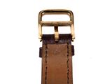 brown leather watch strap with gold buckle on a white background