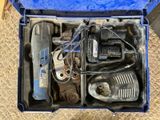 a blue tool box with tools in it on the floor