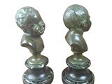pair of bronze busts of a boy and a girl