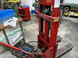 an image of a fork lifter in a warehouse