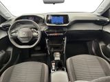 the interior of a small car with a steering wheel and dashboard