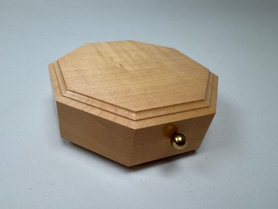 a small wooden box that is on a table