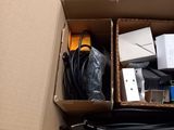 a cardboard box with a bunch of electronics inside of it