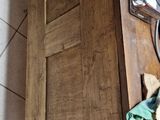 a wooden table with a stuffed animal on top of it
