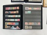 many different types of stamps on the pages of a book
