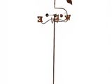 a weather vane with a rooster on top of it