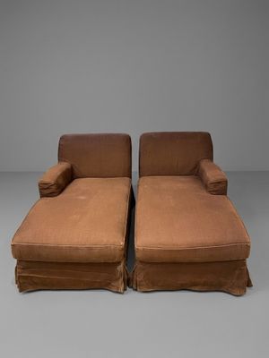 pair of brown chaise loungers with slippers