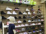 a display of shoes on shelves in a shoe store
