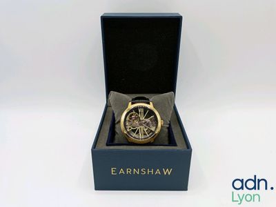 an image of a watch in a black box on a white surface