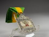 silver plated medal with a green ribbon and a yellow and green ribbon