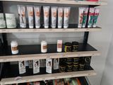 a shelf that has many different types of hair products on it