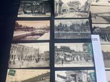 many old photographs of people and buildings on the table