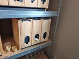many boxes that are on the shelves in the room