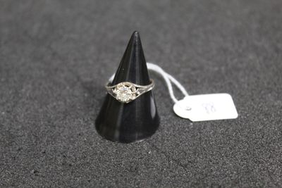 a close up of a ring on a black cone with a price tag