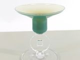a glass cup that is sitting on top of a table