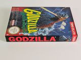 an image of a box of godzilla on a white surface
