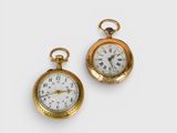 two gold plated pocket watches with roman numerals and roman numerals