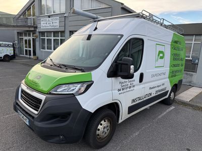 a white and green van parked in a parking lot