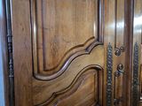 a close up of a wooden door in a room