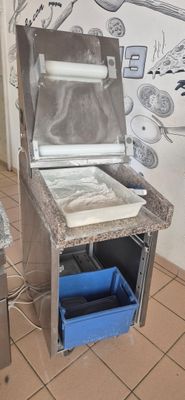 a kitchen with a stove and a refrigerator in it