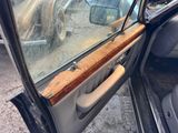 a car door with a wooden handle in it