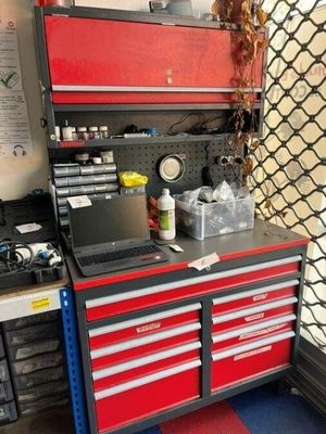 a workbench with a laptop on top of it