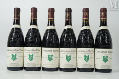six bottles of wine are lined up in a row on a table