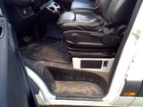 a picture of the inside of a car with the door open