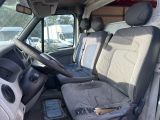 the interior of a van with the driver ' s seat folded down
