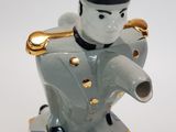 a figurine of a man in a suit and top hat