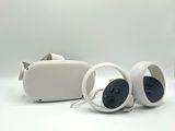 two speakers sitting next to each other on a white surface