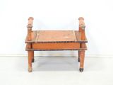 a small wooden bench with a wooden seat on it