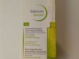 bioderma sebium serum in a bottle on a white surface