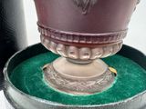 a vase that is sitting in a box on a table