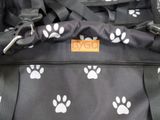 a black bag with white paw prints on it