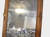 a large mirror that is sitting on the wall