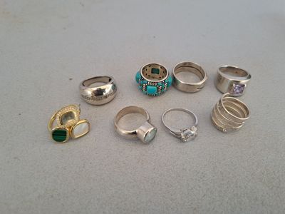 a lot of rings that are sitting on a table