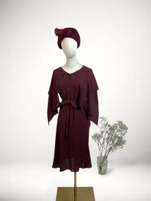 an image of a mannequin wearing a dress and hat