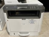 a printer that is sitting on the floor next to a printer