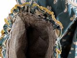 an up close view of the inside of a blue and white dress