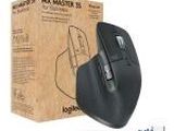 the computer mouse is sitting in front of a cardboard box