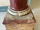 a vase that is sitting on top of a stack of books
